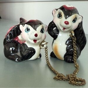 Vintage skunks connected by chain